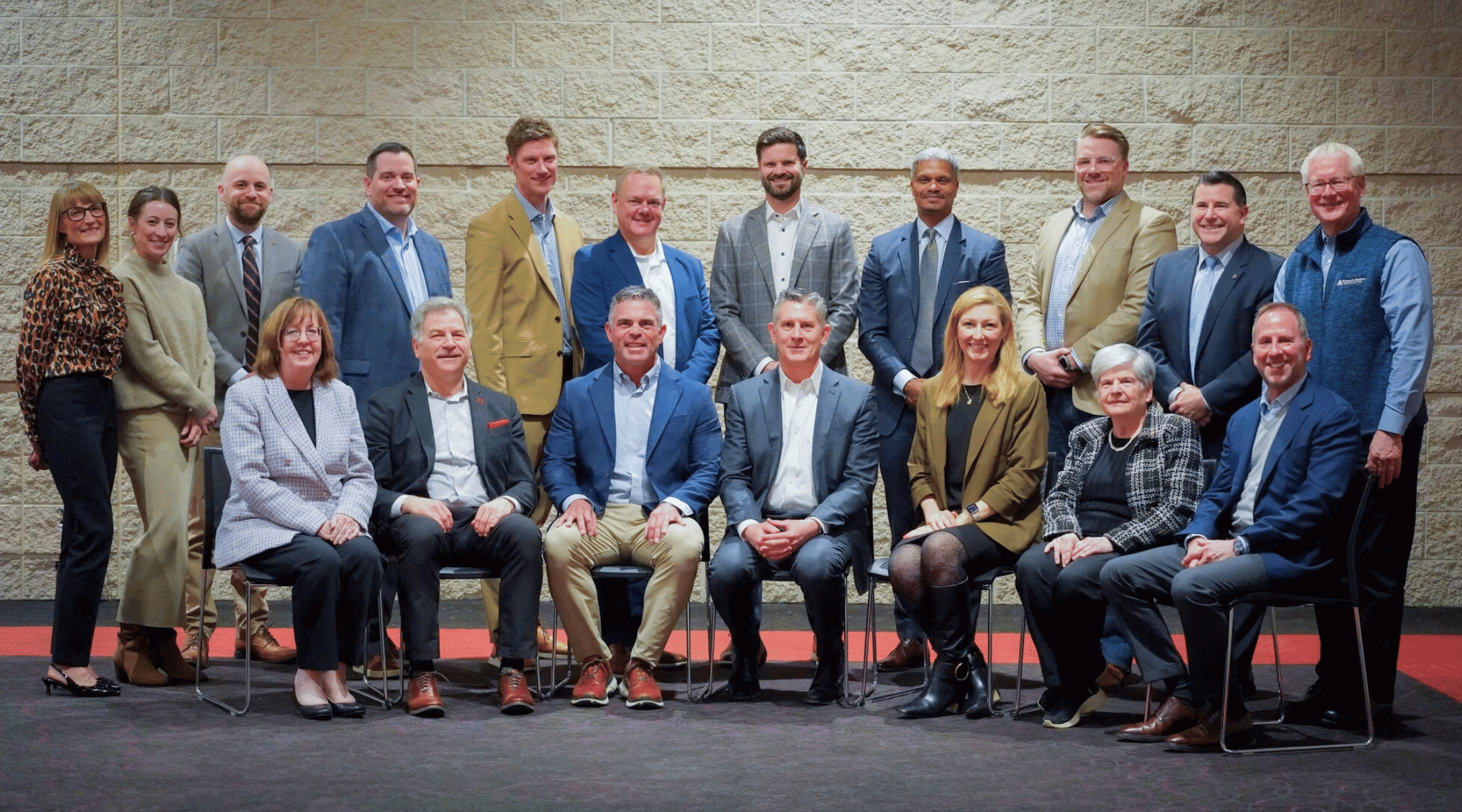 Tony Wied and Michael Ericson sit center at a meeting in the Wisconsin 8th