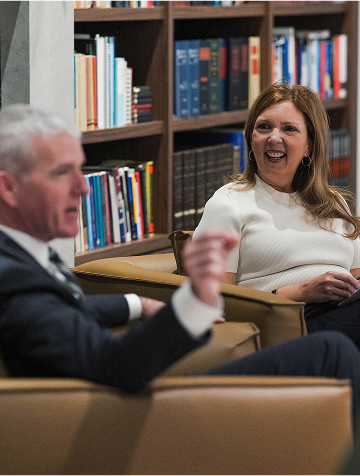 a women sitting in a chair laughing