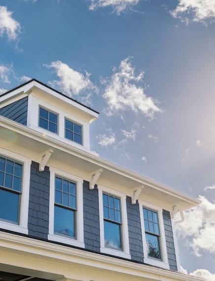 Windows on a house and the sky
